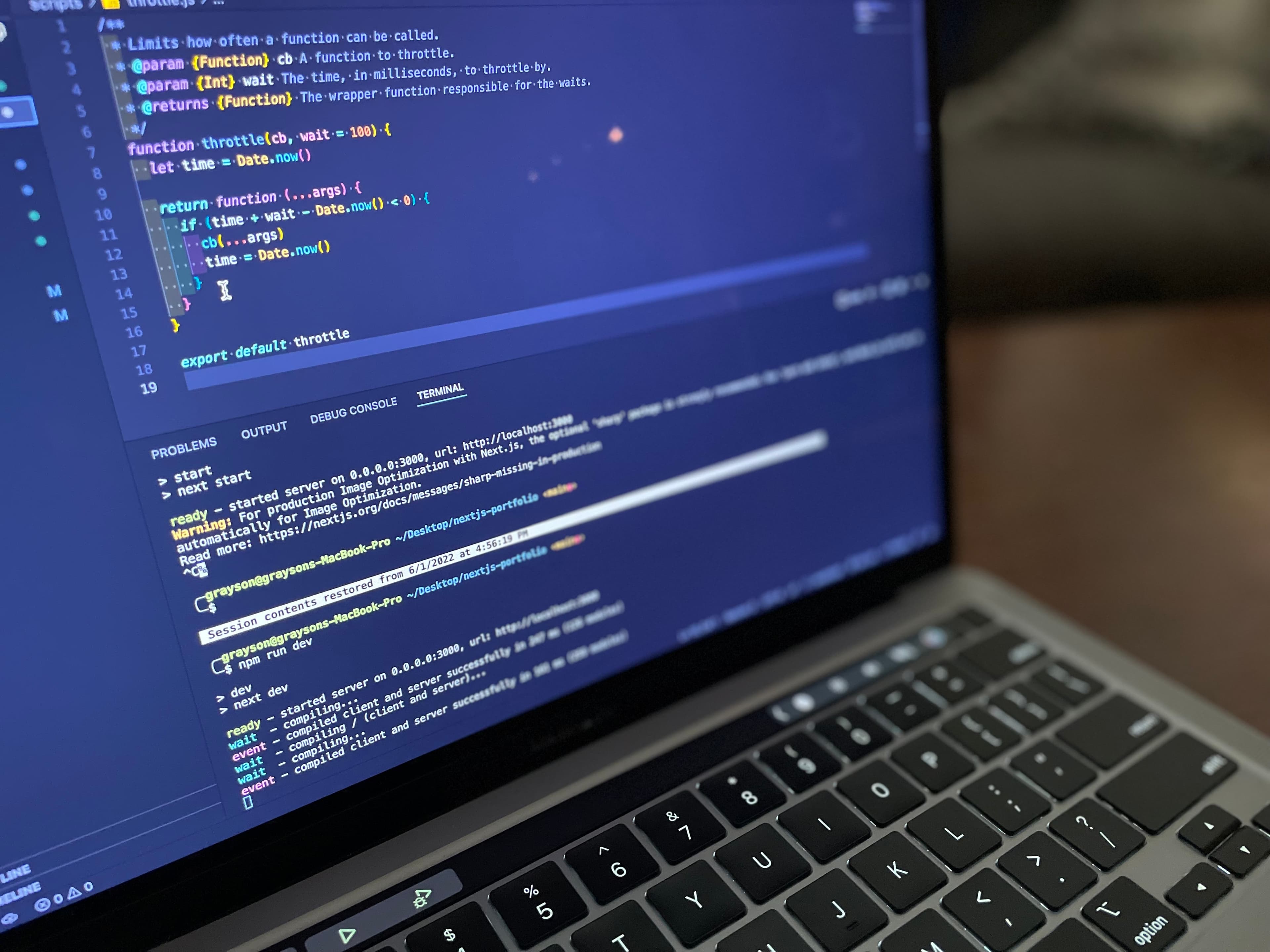 Photo of a laptop with code on its screen