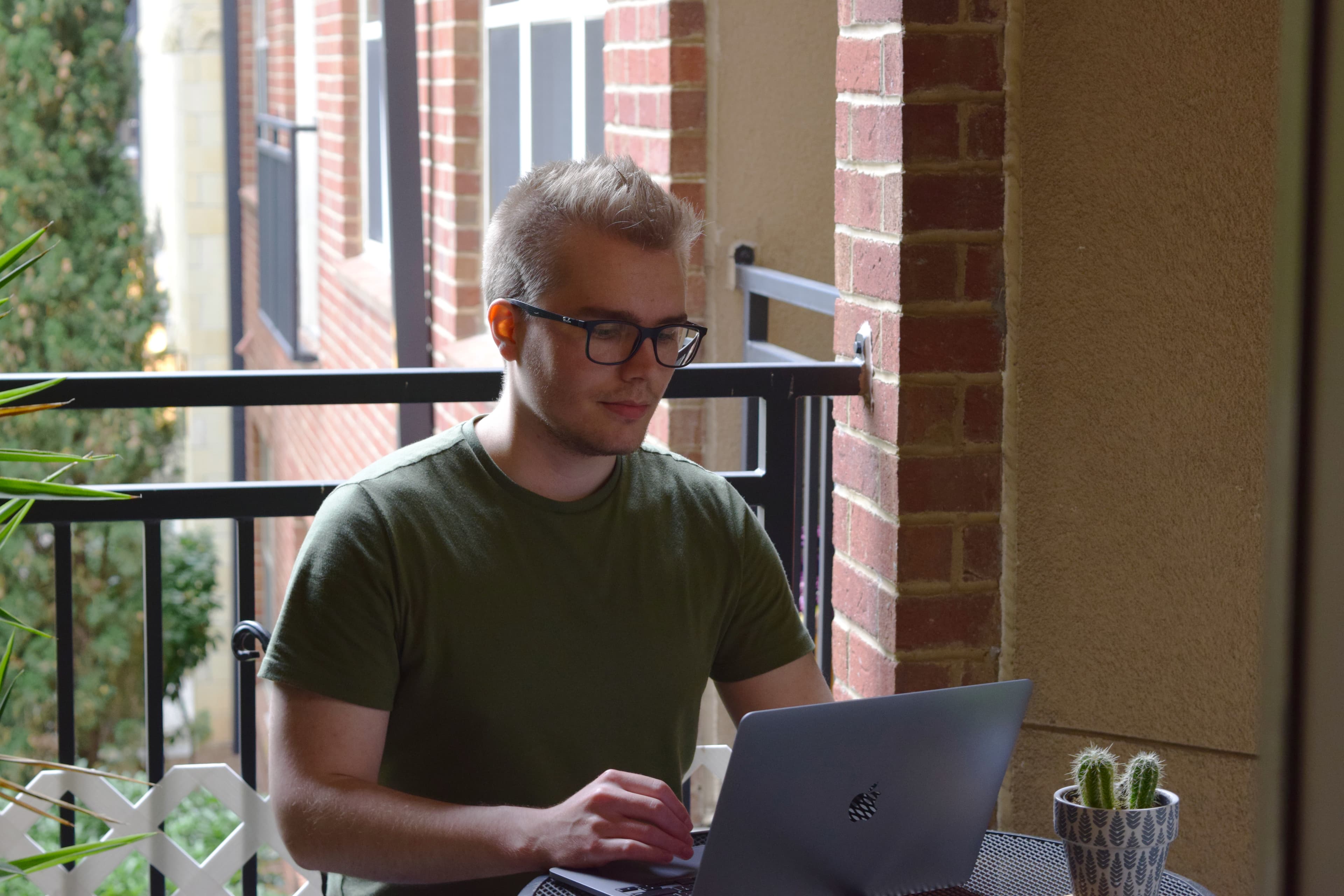 Me on a patio working on my laptop